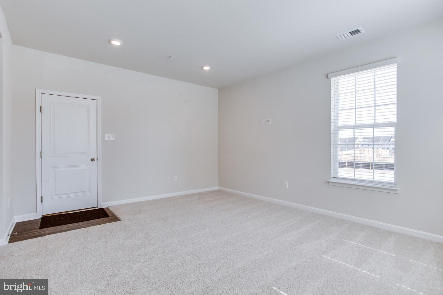 7068 Delegate Place Frederick, MD 21703 - Photo 13 of 76 an empty room with windows