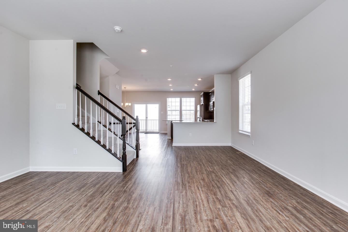 7068 Delegate Place Frederick, MD 21703 - Photo 20 of 76 a view of entryway and hall with wooden floor