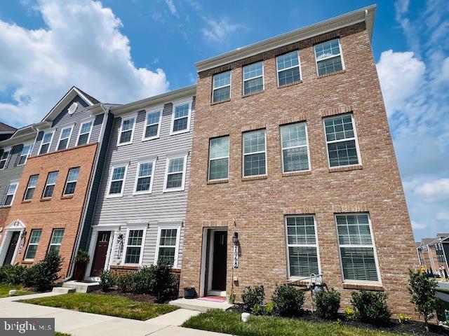 7068 Delegate Place Frederick, MD 21703 - Photo 2 of 76 a front view of a house with garden