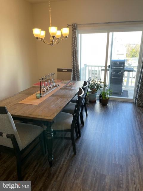 7068 Delegate Place Frederick, MD 21703 - Photo 30 of 76 a view of a dining room with furniture window and wooden floor