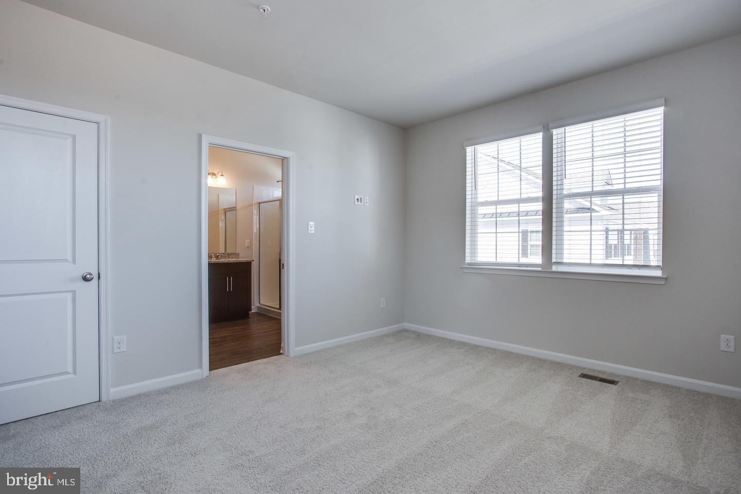 7068 Delegate Place Frederick, MD 21703 - Photo 37 of 76 an empty room with windows and closet