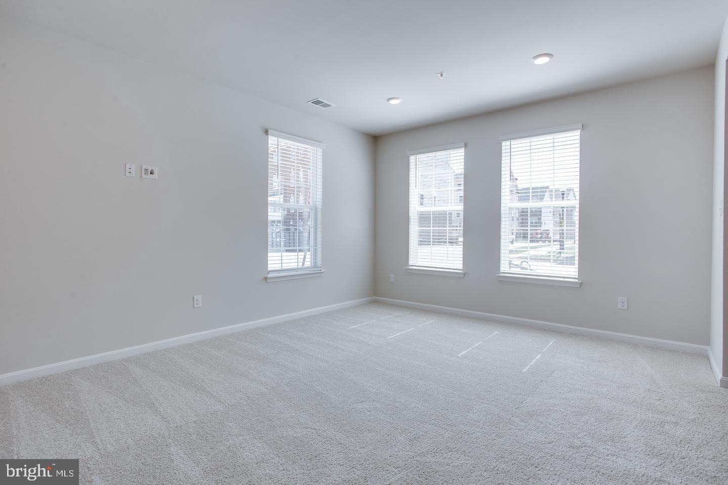 7068 Delegate Place Frederick, MD 21703 - Photo 10 of 76 a view of an empty room with a window