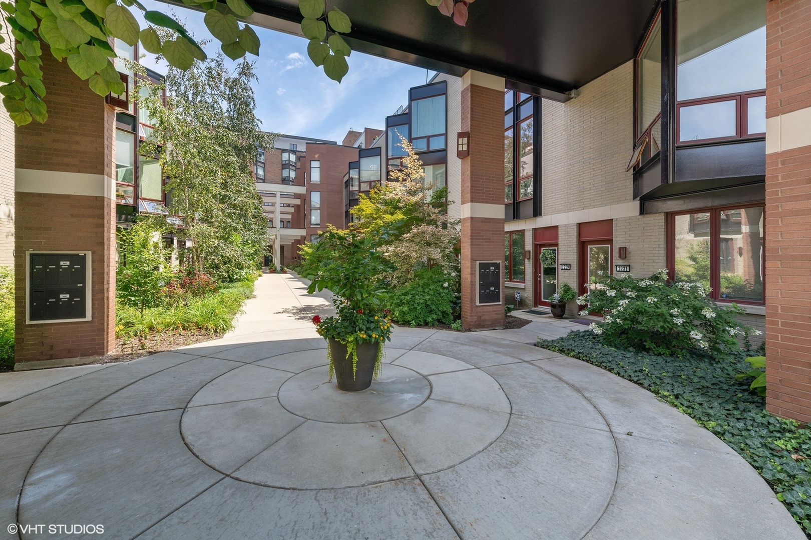 a view of a building with potted plants