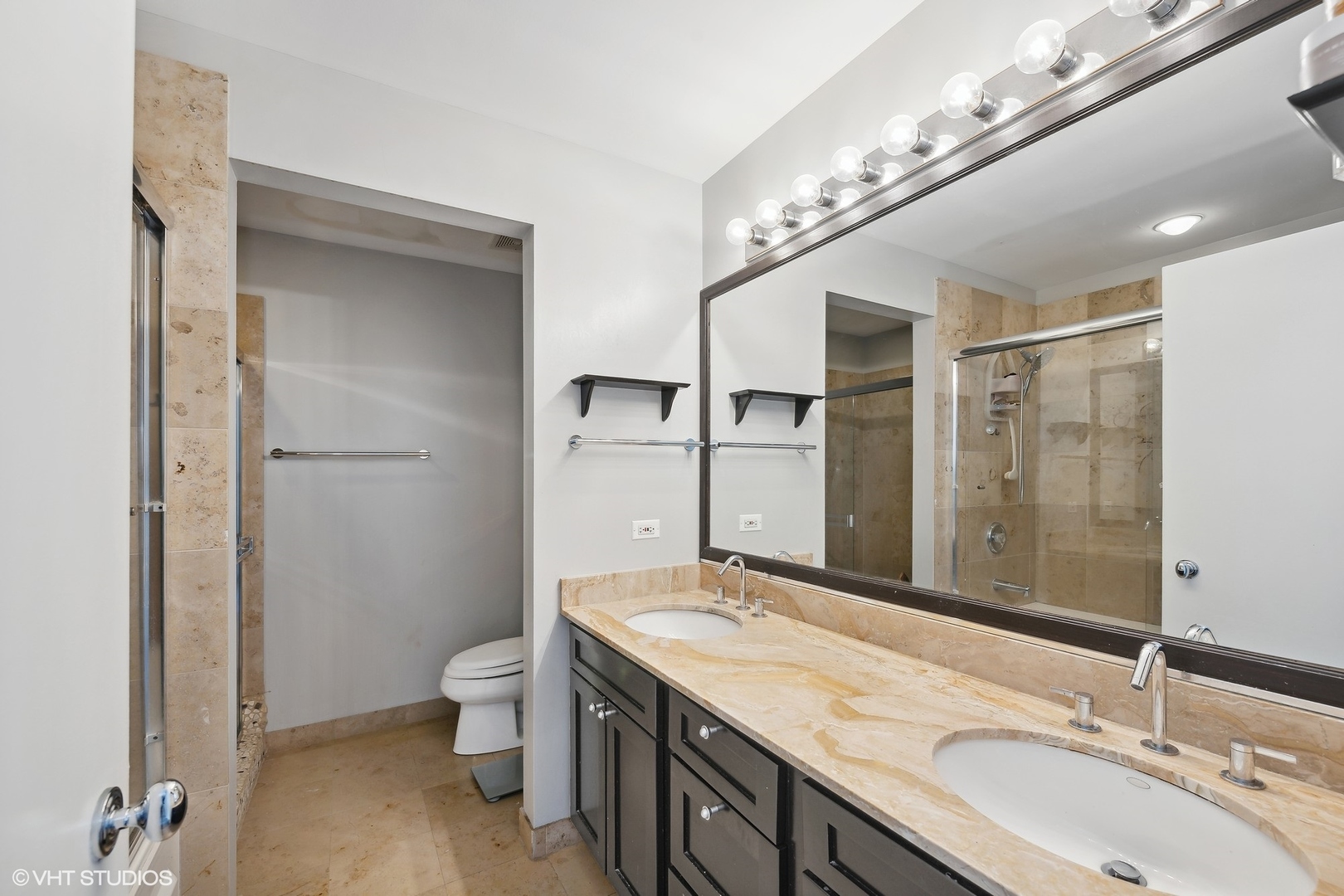 222 South Racine Avenue, Unit 48 Chicago, IL 60607 - Photo 11 of 21 a bathroom with a granite countertop sink a toilet a mirror and shower