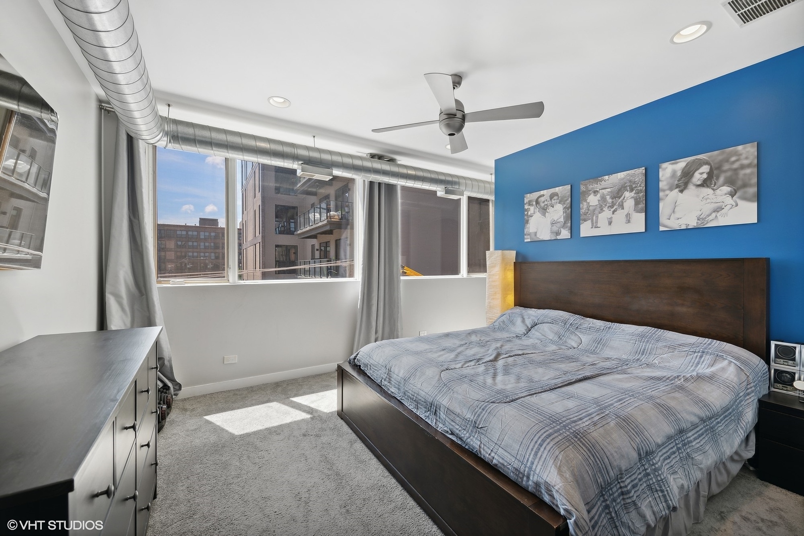 222 South Racine Avenue, Unit 48 Chicago, IL 60607 - Photo 9 of 21 a bedroom with a large bed and a window