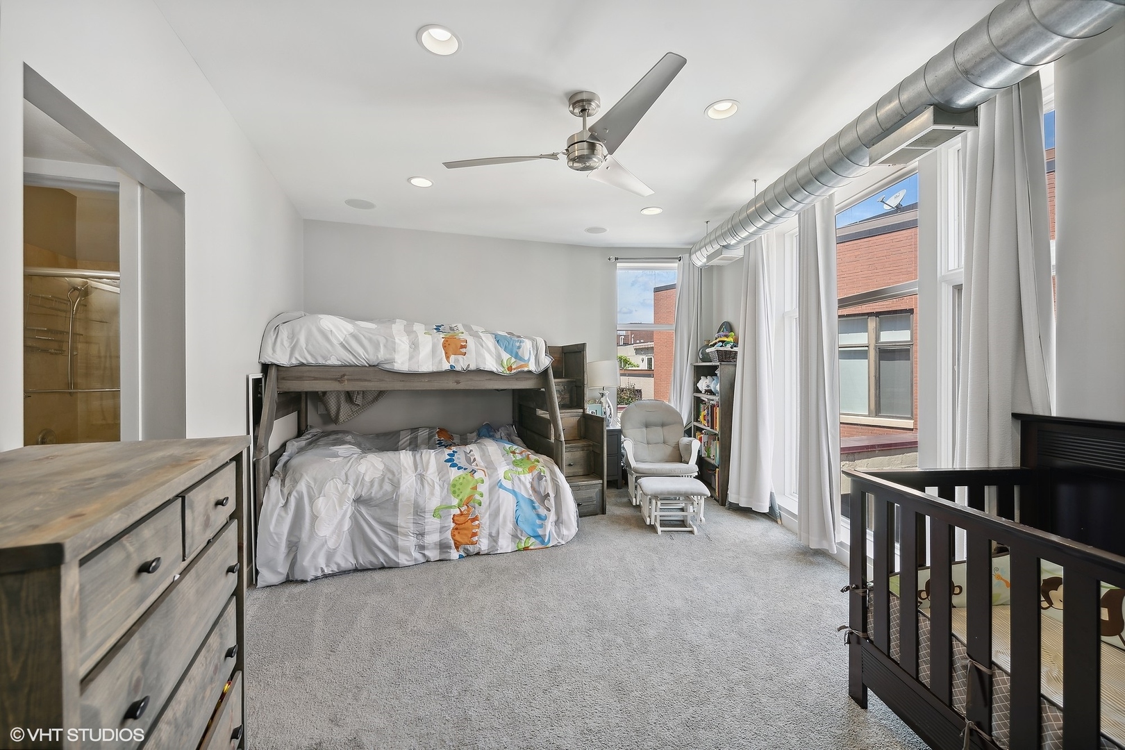 222 South Racine Avenue, Unit 48 Chicago, IL 60607 - Photo 10 of 21 a bedroom with furniture and a window