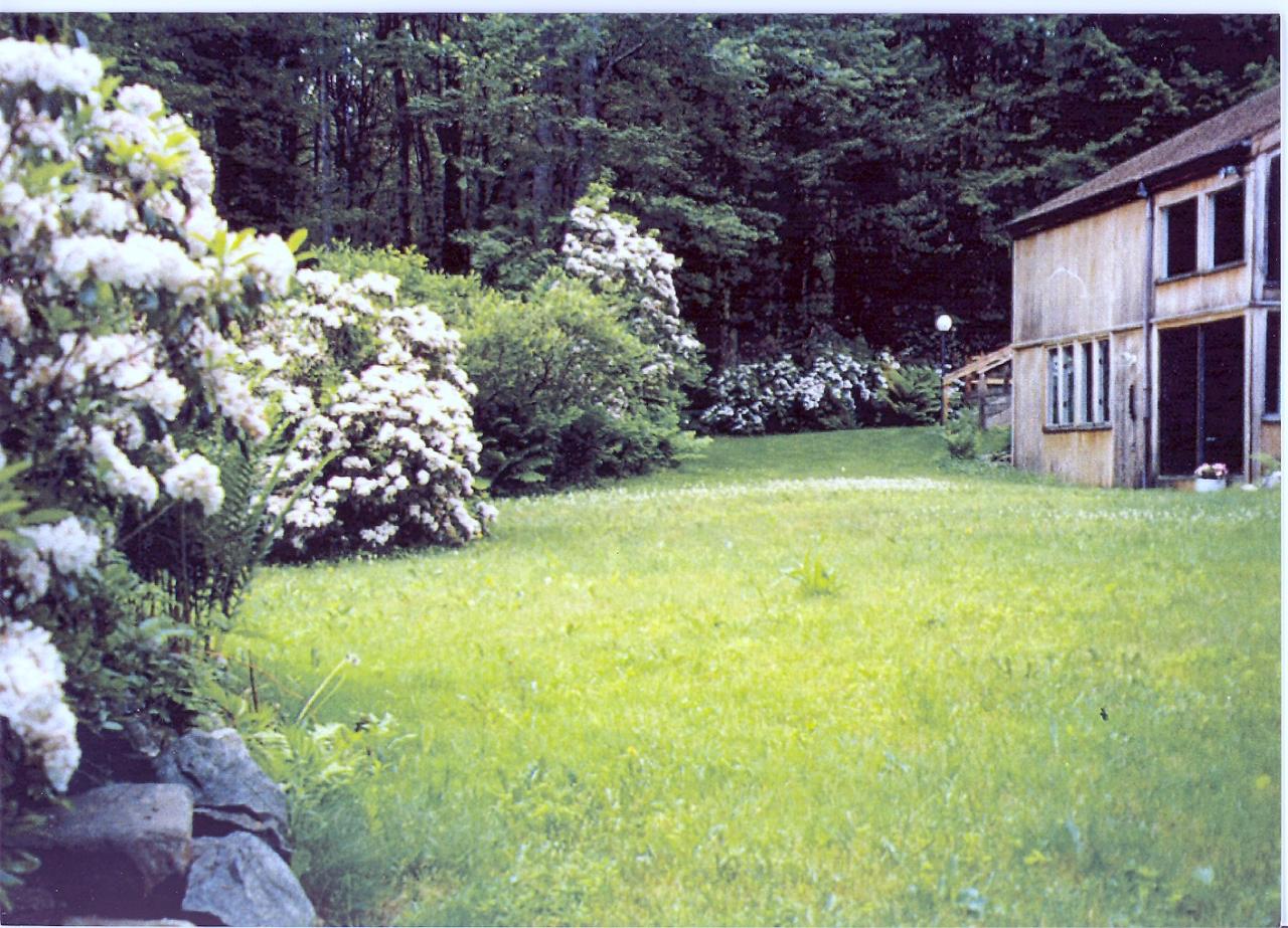 38 Rood Hill Road Sandisfield, MA 01255 - Photo 21 of 25 a view of a house with a yard and garden