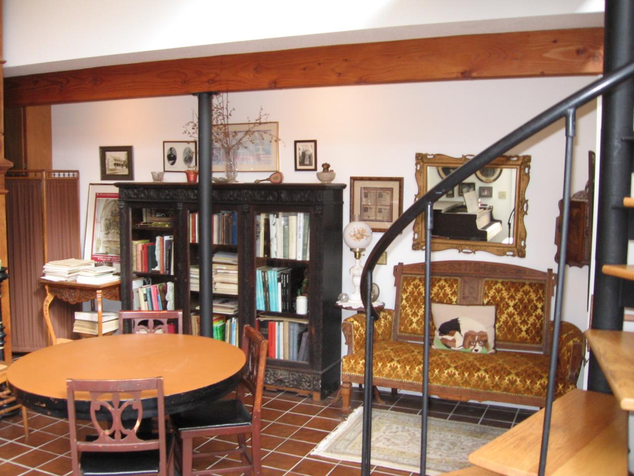 38 Rood Hill Road Sandisfield, MA 01255 - Photo 9 of 25 a balcony with furniture and a book shelf