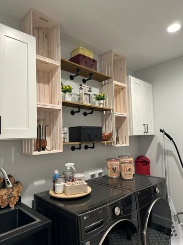 a kitchen with stainless steel appliances a sink a stove and a refrigerator