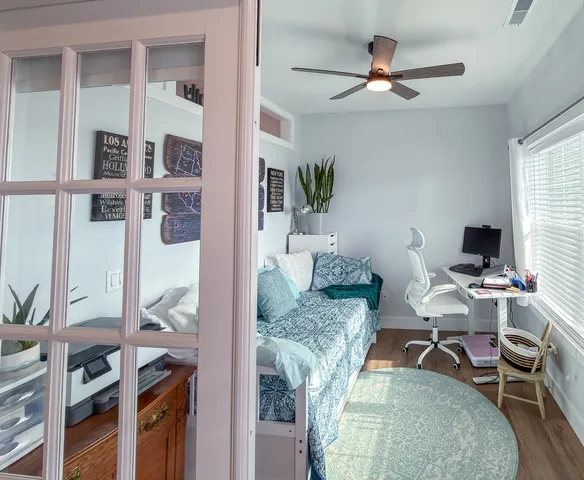 a workspace with furniture and a rug