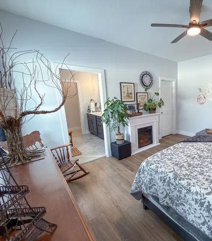 a bedroom with a bed and a fireplace