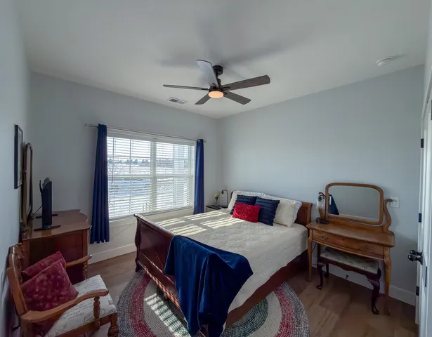 a bedroom with a bed and a couch