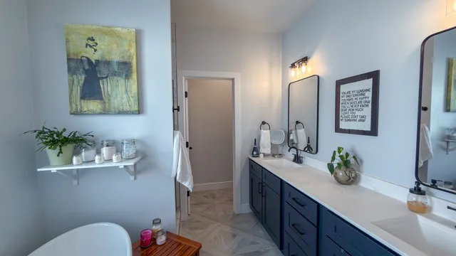 a bathroom with a sink a mirror and vanity