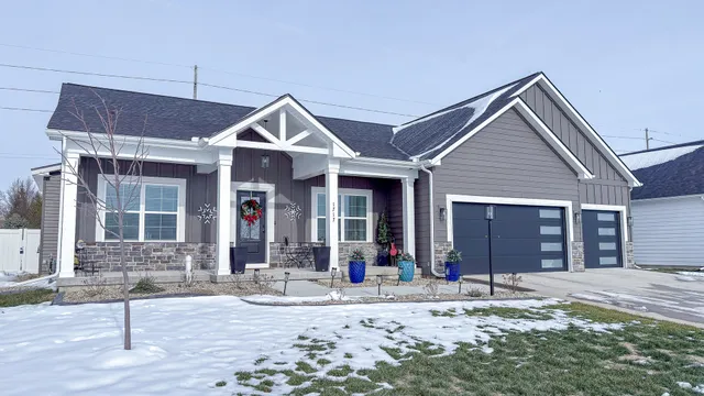 a front view of a house with a yard and porch