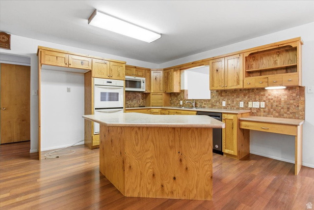 217 East 400 South Spring City, UT 84662 - Photo 8 of 71 Kitchen with light countertops, open shelves, white appliances, and light wood finished floors