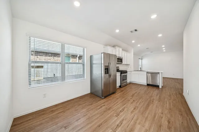 a view of kitchen with wooden floor