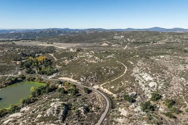 an aerial view of residential house and lake view