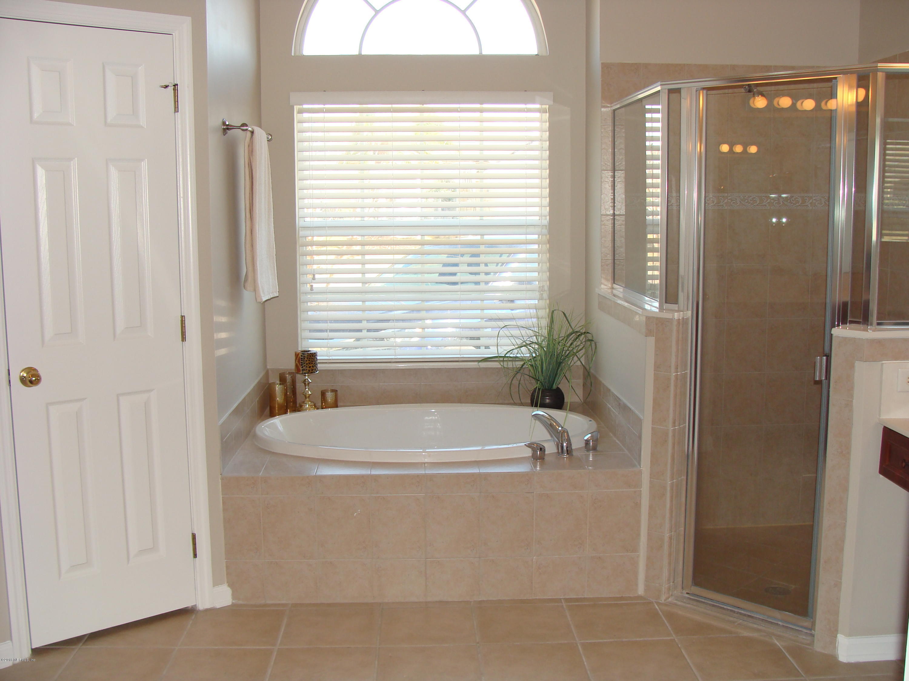 258 Porta Rosa Circle St. Augustine, FL 32092 - Photo 10 of 37 a bathroom with a bathtub and shower