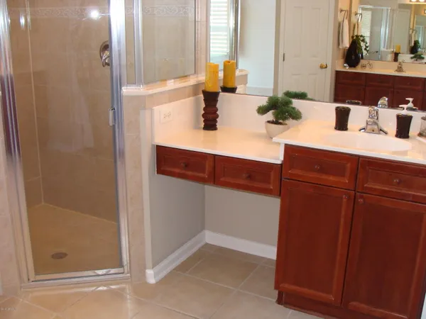 a bathroom with a bathtub and shower