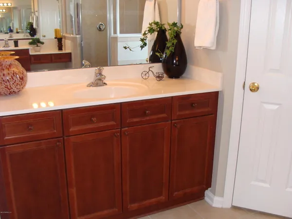a bathroom with a sink and a mirror