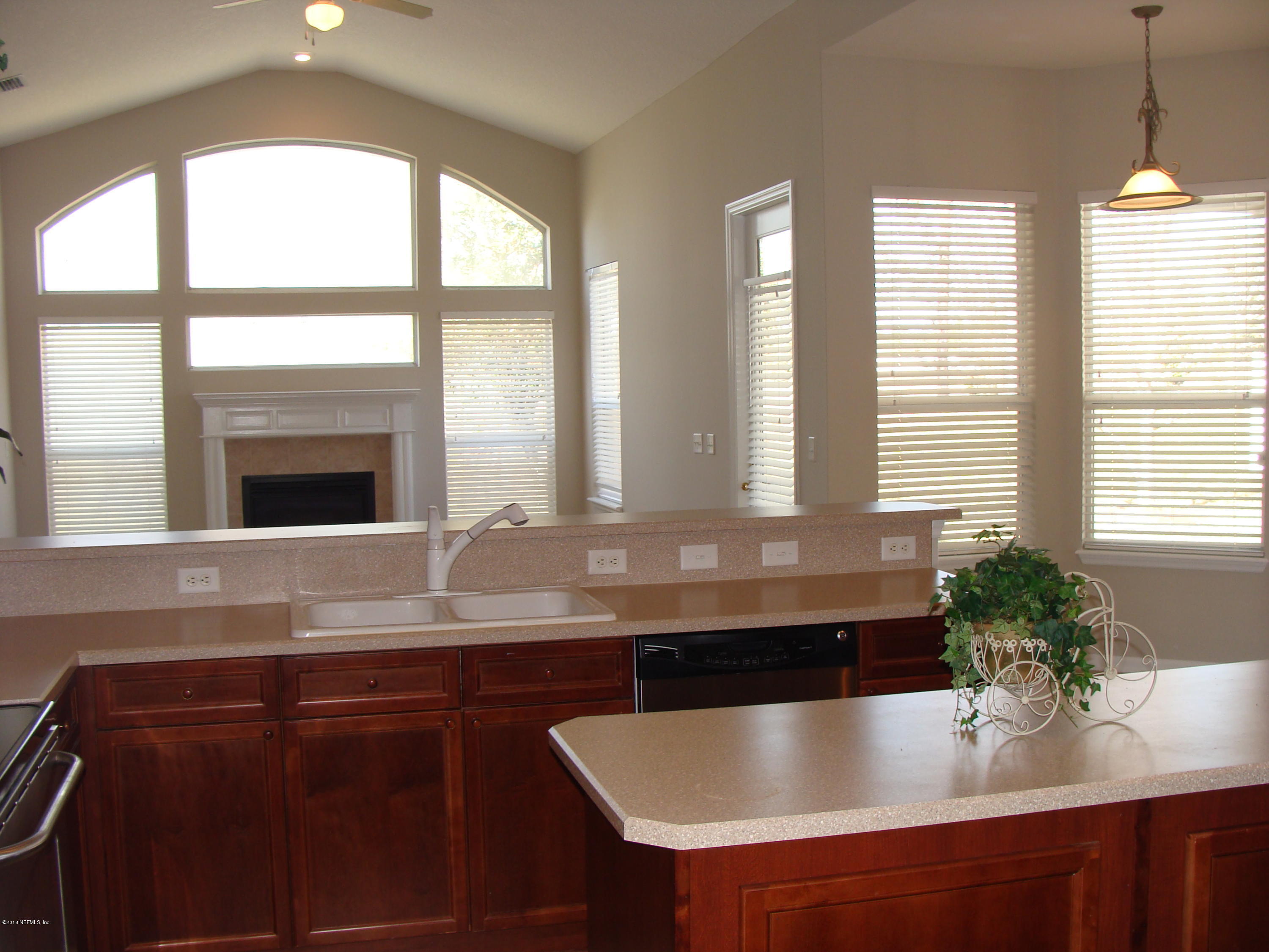 258 Porta Rosa Circle St. Augustine, FL 32092 - Photo 17 of 37 a kitchen with a table chairs and window