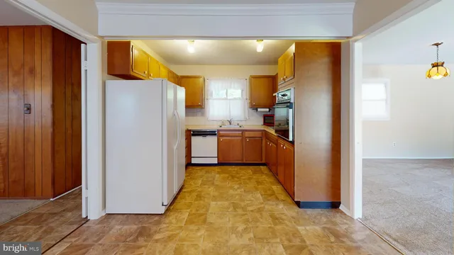 a view of a kitchen with a refrigerator