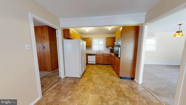 a view of a big room with closet and front door