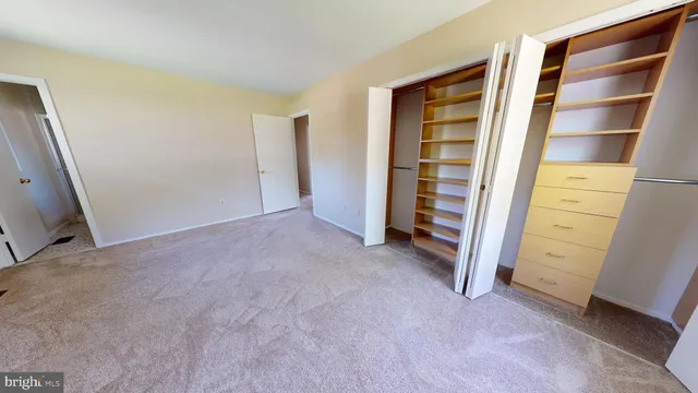 a view of room with closet and racks