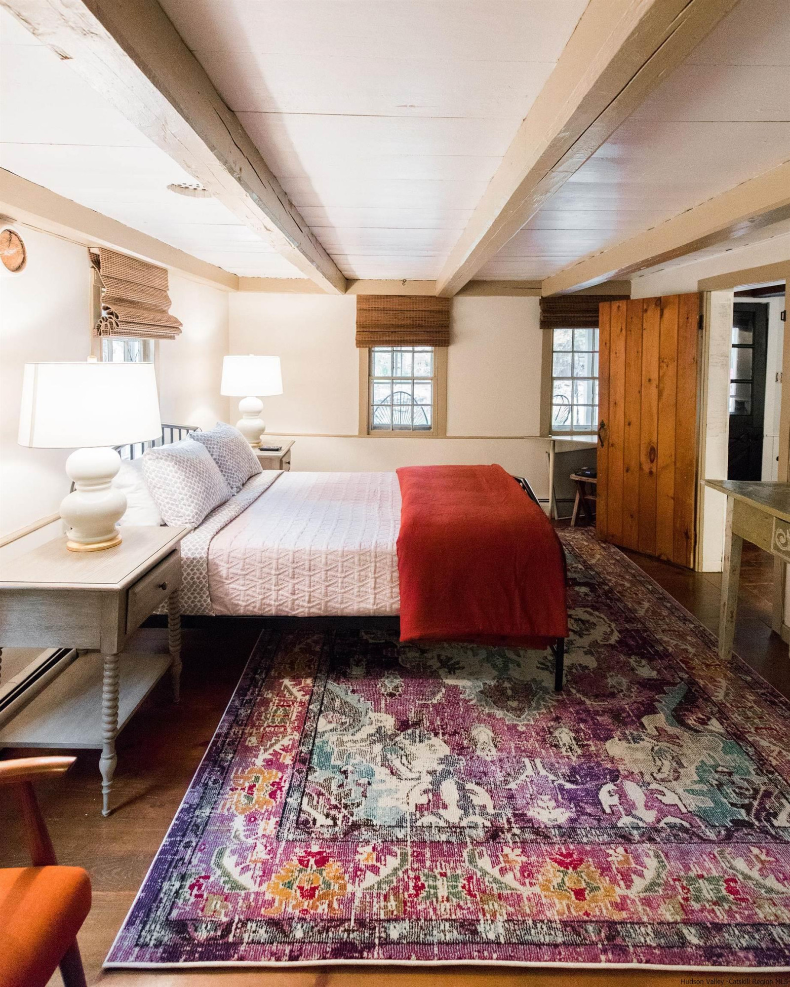 30 Old Farm Road Stone Ridge, NY 12484 - Photo 15 of 30 a spacious bedroom with a bed a dresser and large windows