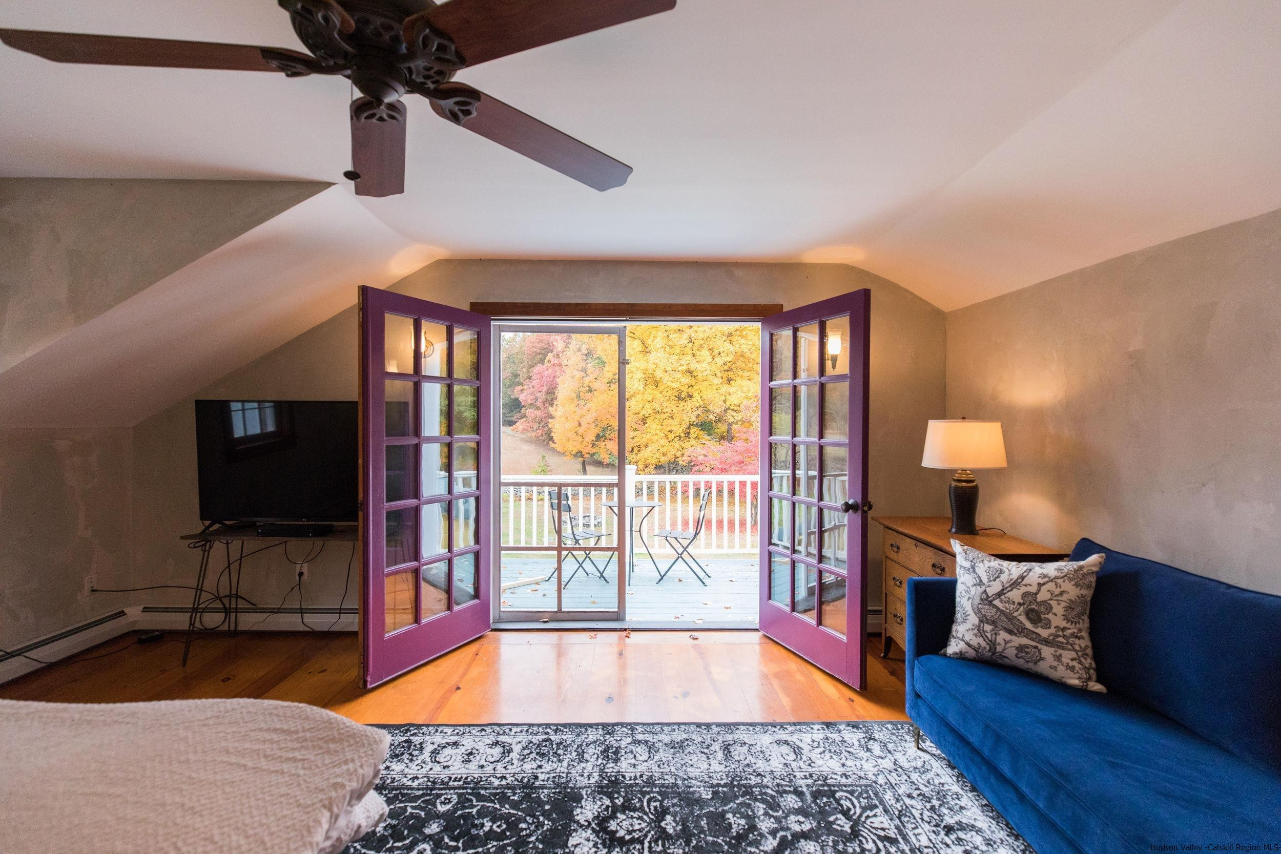 30 Old Farm Road Stone Ridge, NY 12484 - Photo 18 of 30 a large bedroom with a bed and wooden floor