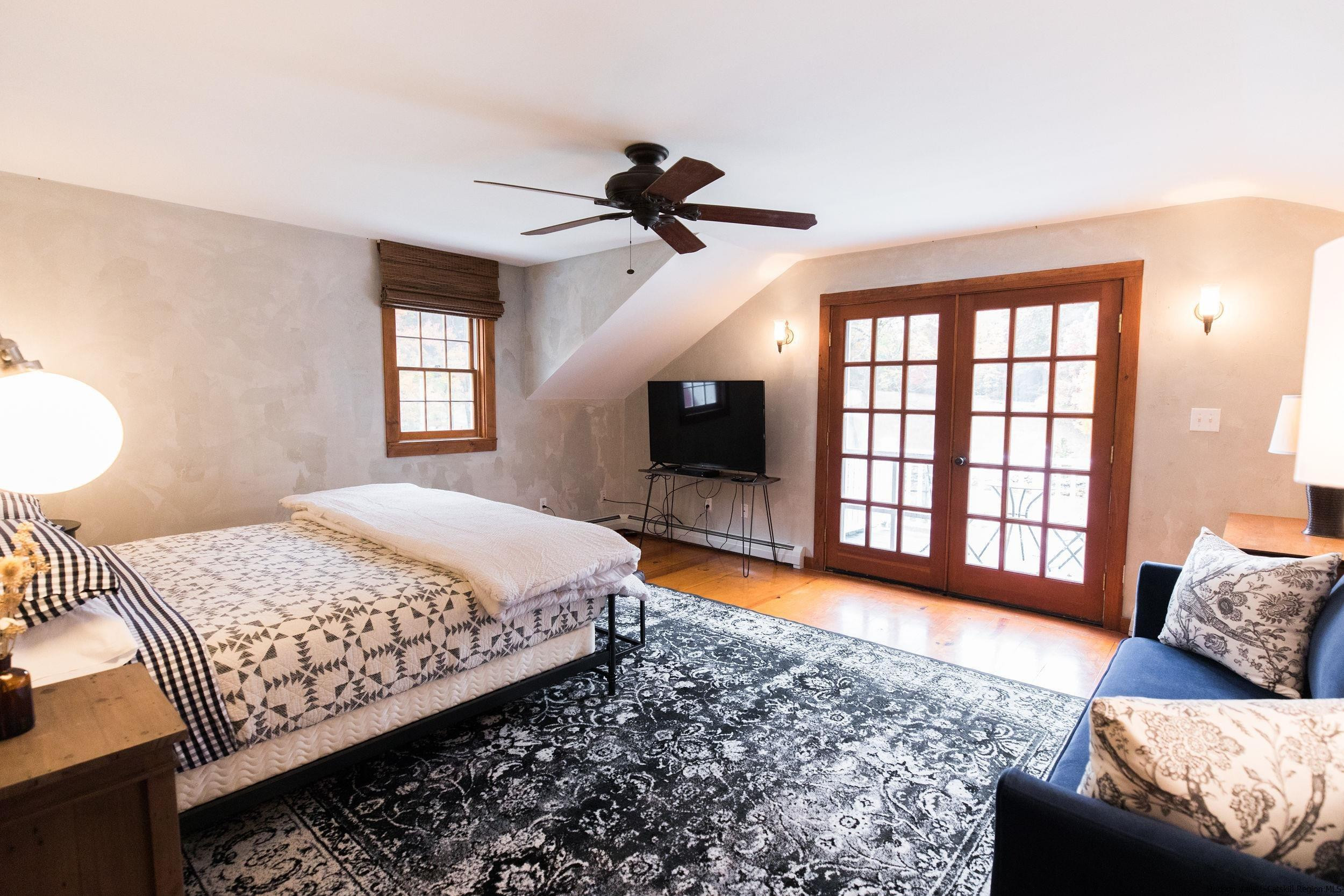 30 Old Farm Road Stone Ridge, NY 12484 - Photo 21 of 30 a bedroom with a bed and a couch