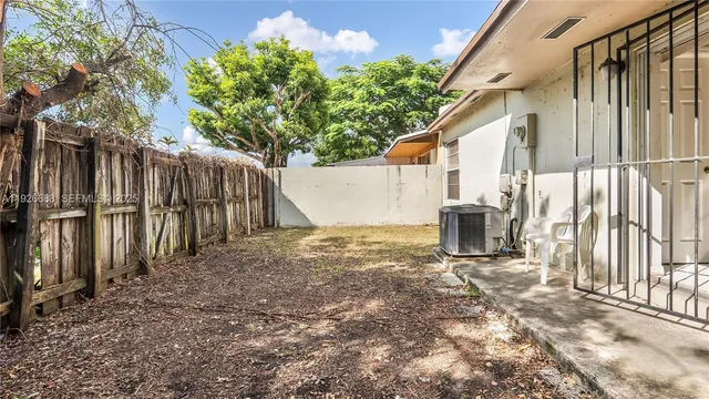 a view of a backyard of the house