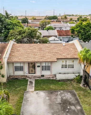 an aerial view of a house with garden