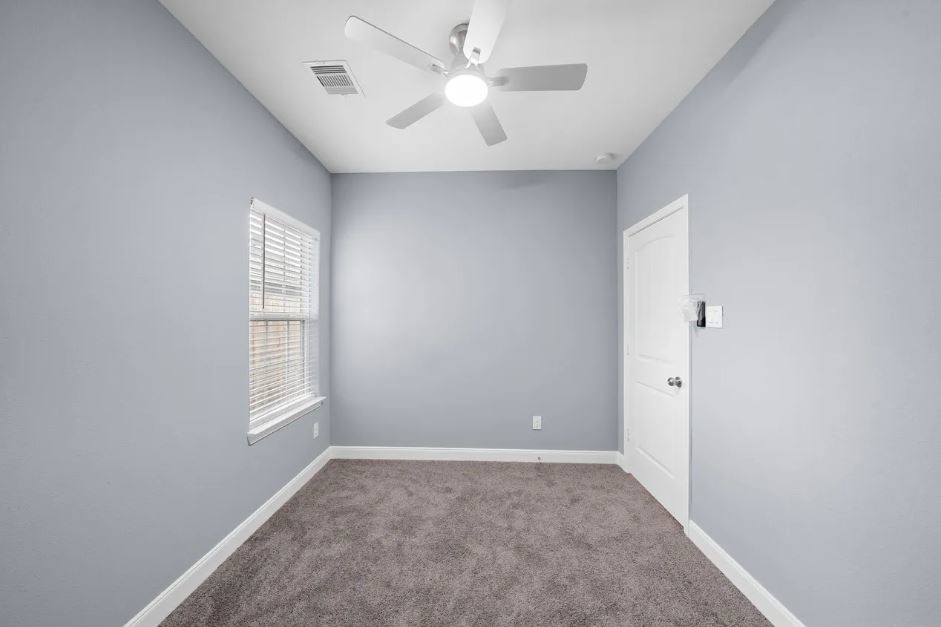 5222 Bataan Road Houston, TX 77033 - Photo 14 of 22 Private bedroom retreat with soft natural light and a sophisticated, modern layout.