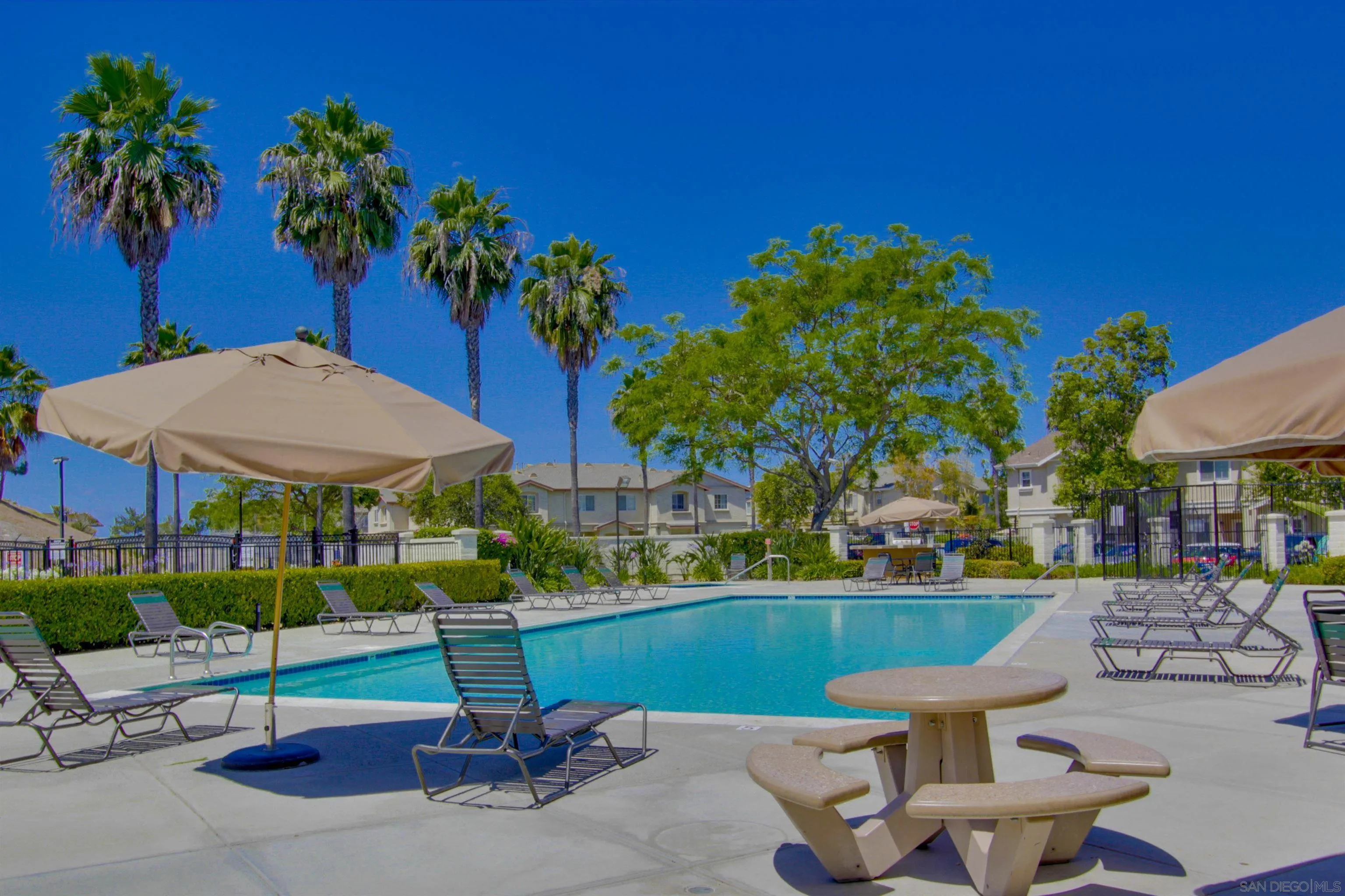 a view of a backyard with a patio and plants