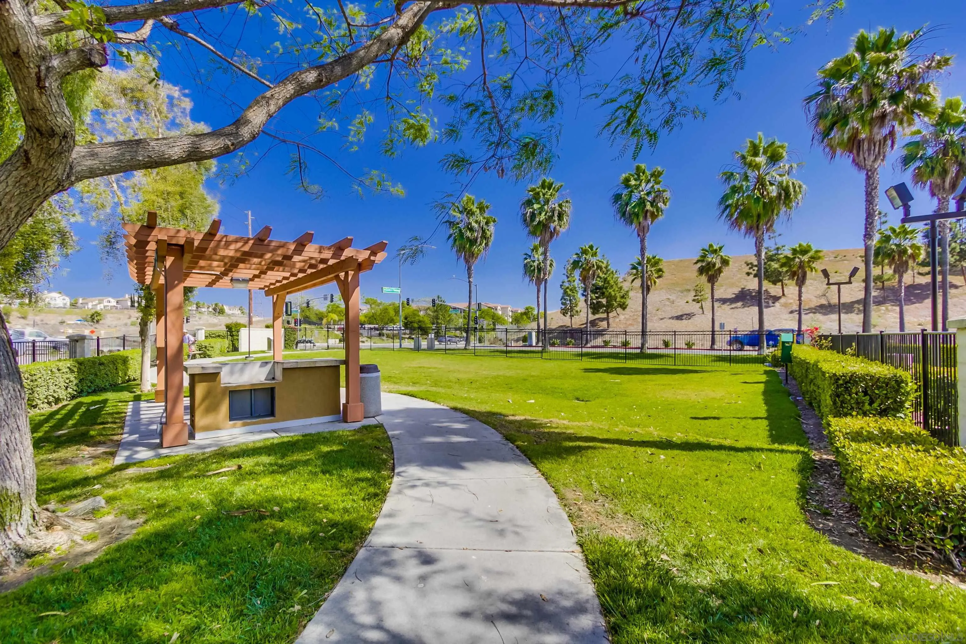 1201 Trapani Cove, Unit 4 Chula Vista, CA 91915 - Photo 2 of 37 a view of a swimming pool with a yard