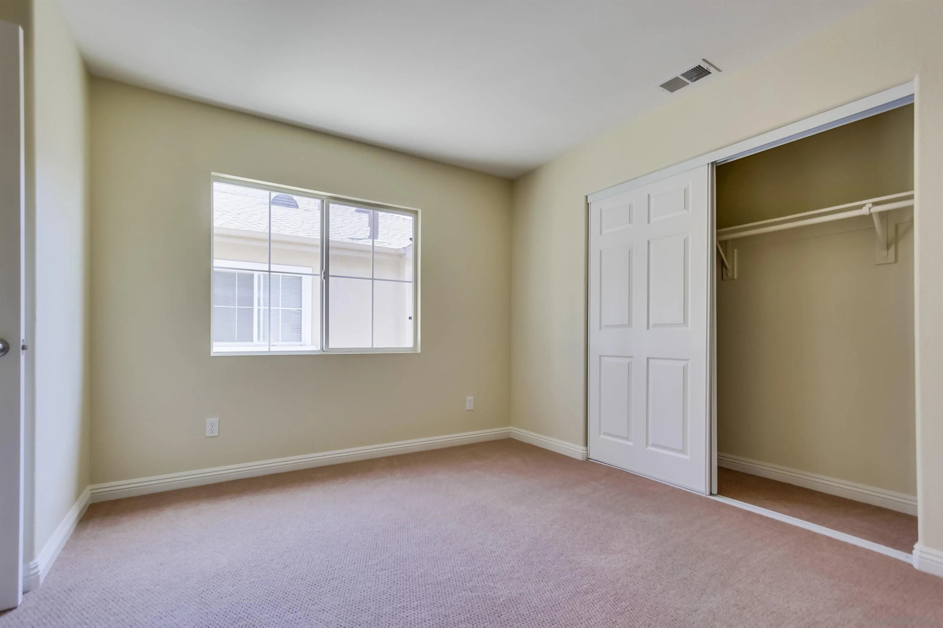 1201 Trapani Cove, Unit 4 Chula Vista, CA 91915 - Photo 21 of 37 an empty room with windows