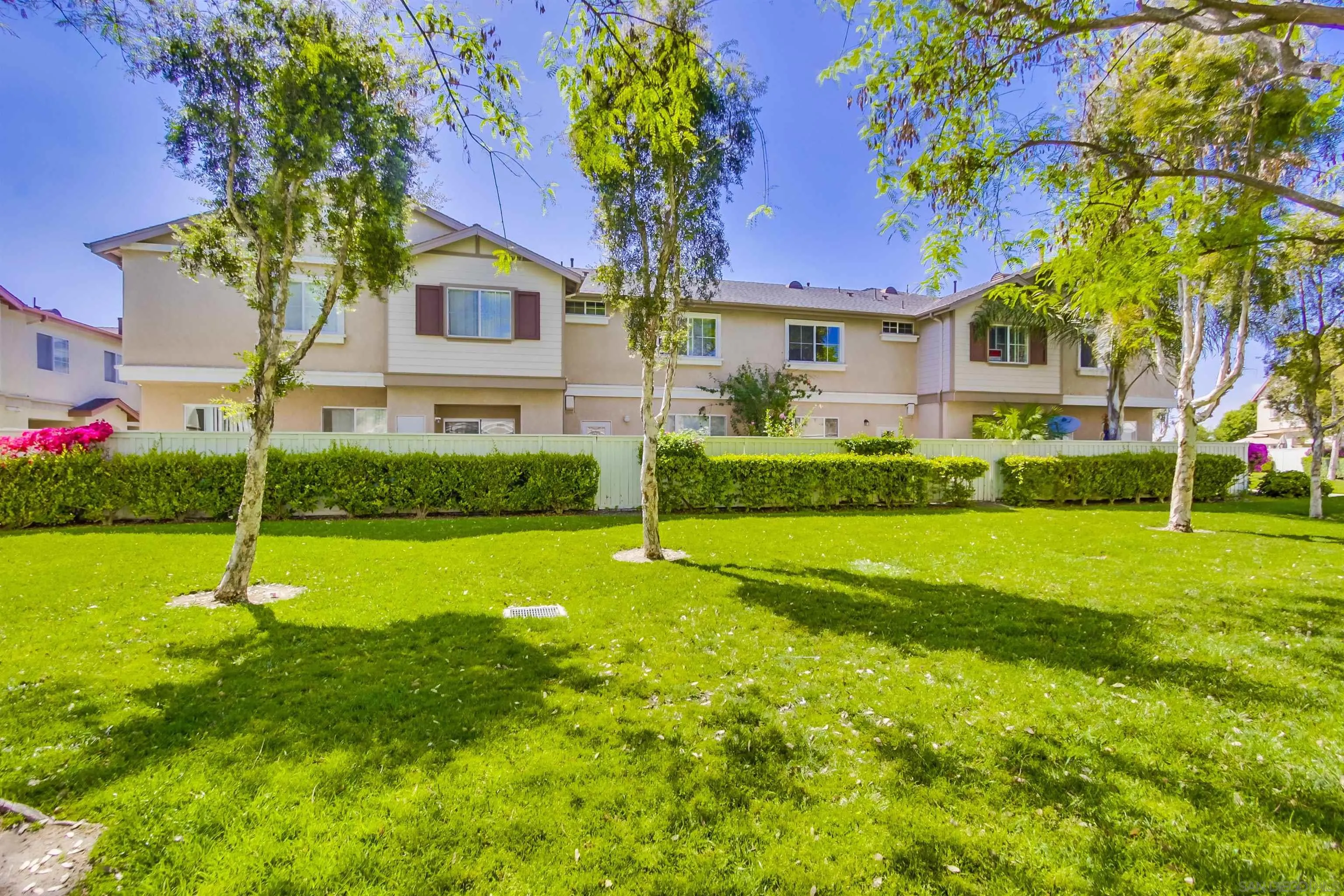 1201 Trapani Cove, Unit 4 Chula Vista, CA 91915 - Photo 30 of 37 a front view of house with yard and green space