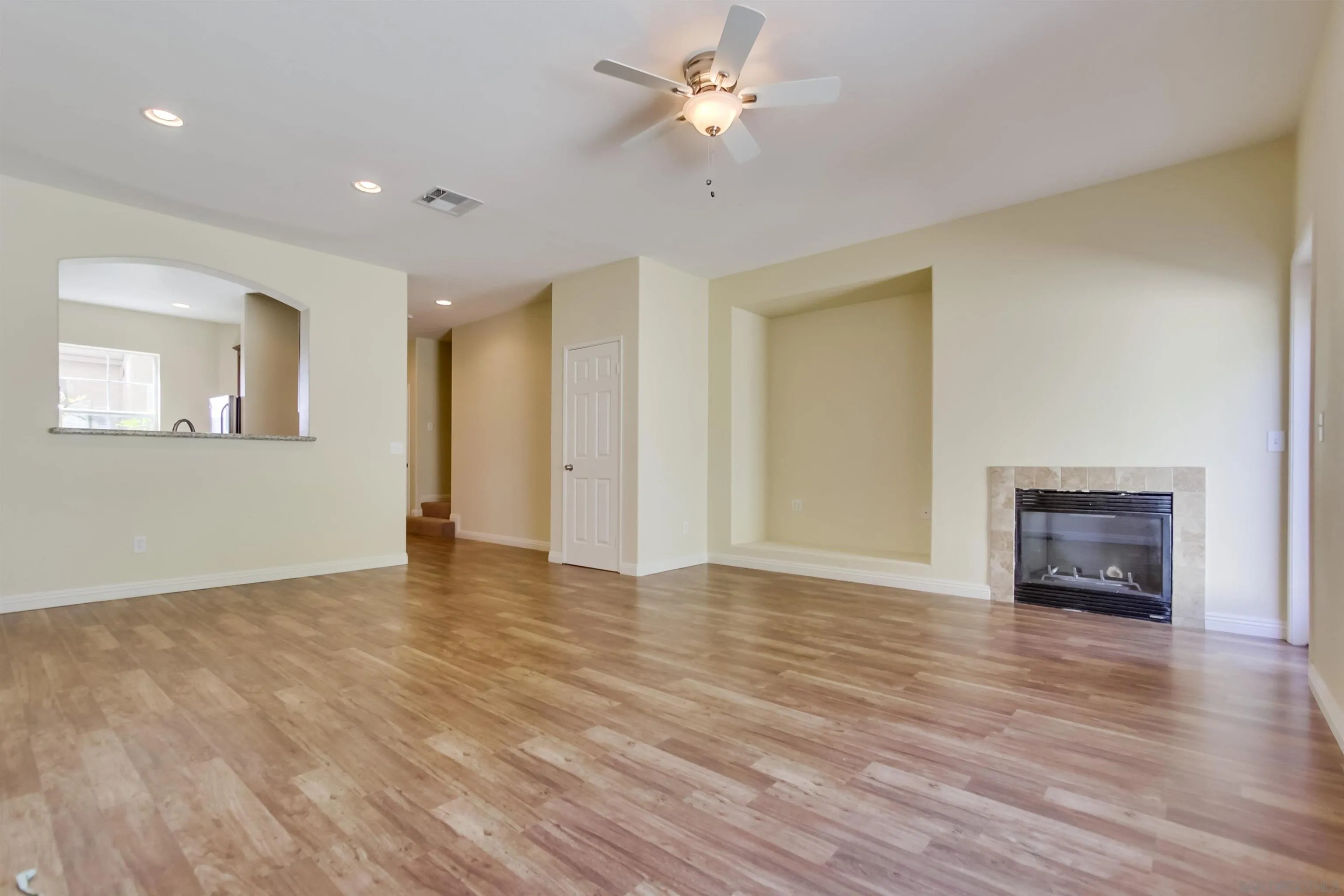 1201 Trapani Cove, Unit 4 Chula Vista, CA 91915 - Photo 9 of 37 a view of an empty room with a window and a kitchen