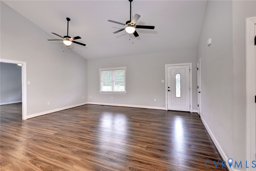 8904 Rock Cedar Road New Kent, VA 23124 - Photo 5 of 37 wooden floor in an empty room with a window