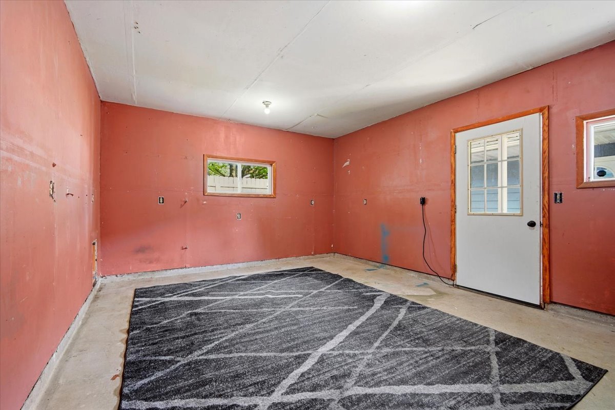 203 Highview Drive Eureka, IL 61530 - Photo 42 of 49 an empty room with wooden floor and window