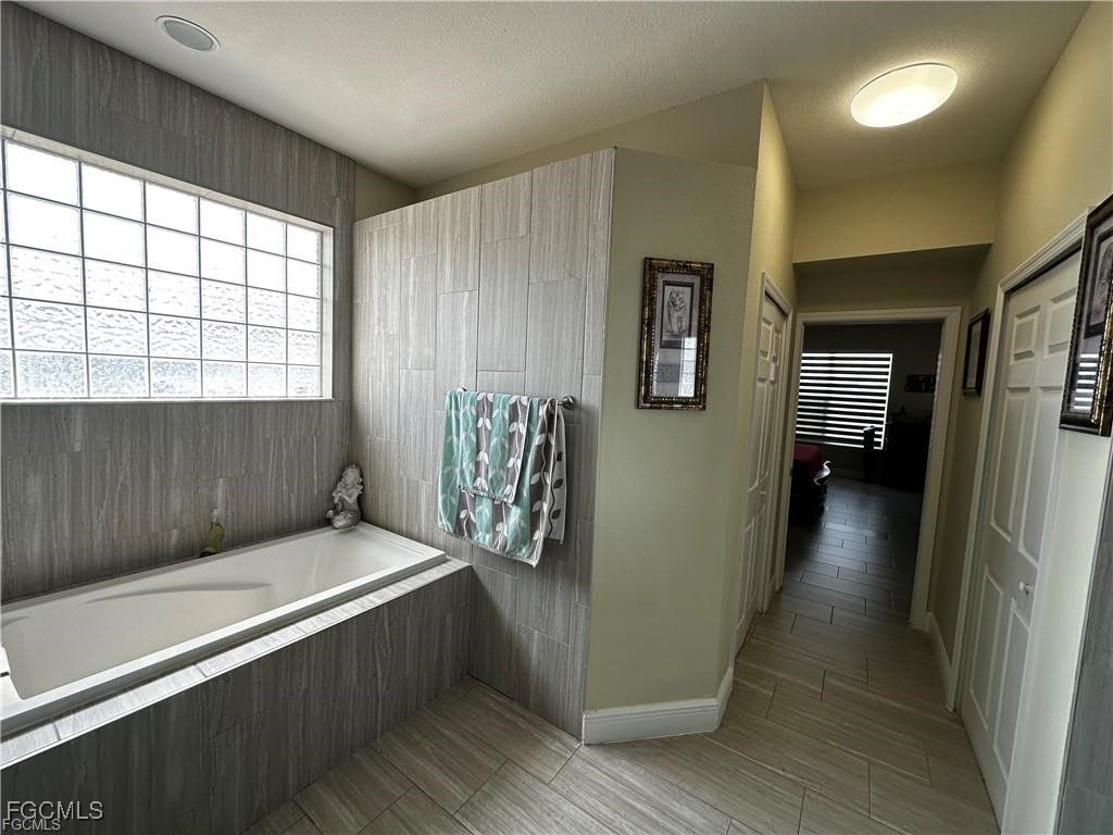 3315 37th Street Southwest Lehigh Acres, FL 33976 - Photo 23 of 34 a view of entryway with wooden floor