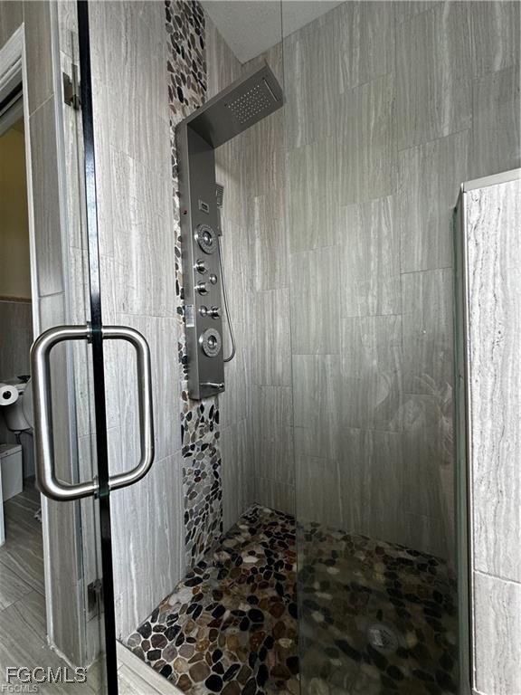 3315 37th Street Southwest Lehigh Acres, FL 33976 - Photo 26 of 34 a bathroom with a shower