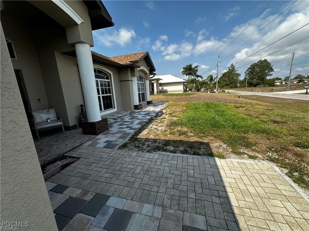 3315 37th Street Southwest Lehigh Acres, FL 33976 - Photo 5 of 34 a view of a porch with a yard