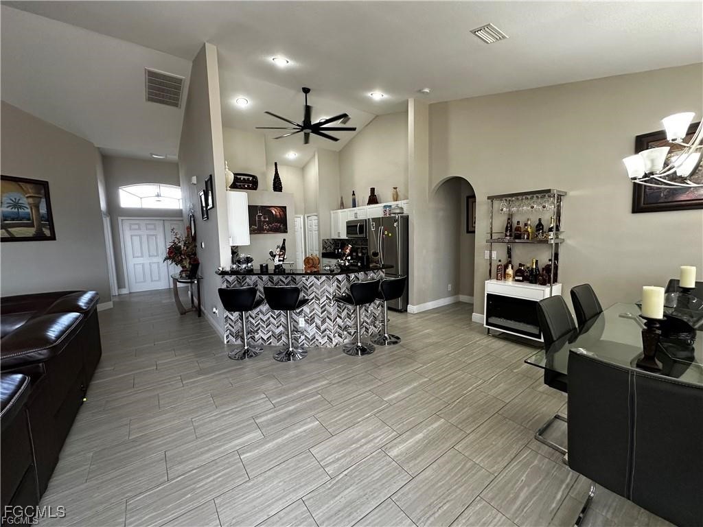 3315 37th Street Southwest Lehigh Acres, FL 33976 - Photo 9 of 34 a living room with furniture and wooden floor