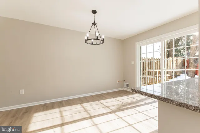 a view of a room with a large window