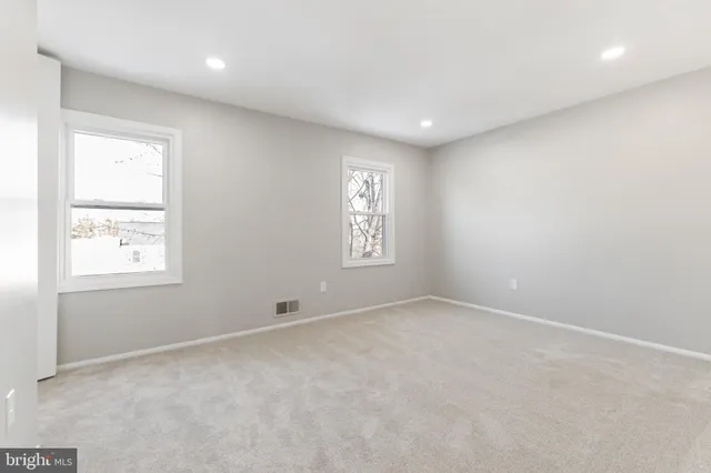 an empty room with windows