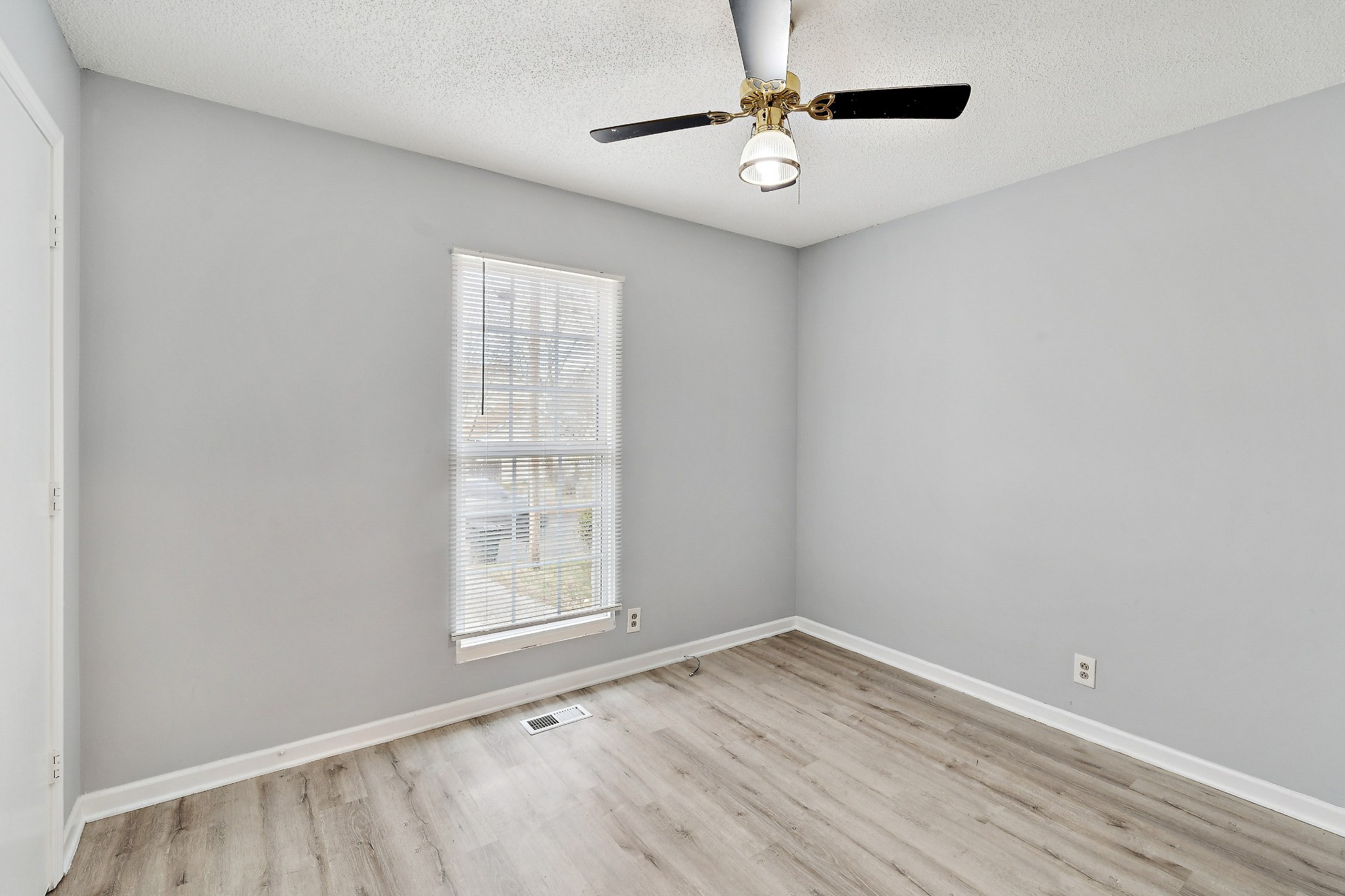 1205 Jacksons Hill Road Hermitage, TN 37076 - Photo 12 of 28 wooden floor in an empty room with a window