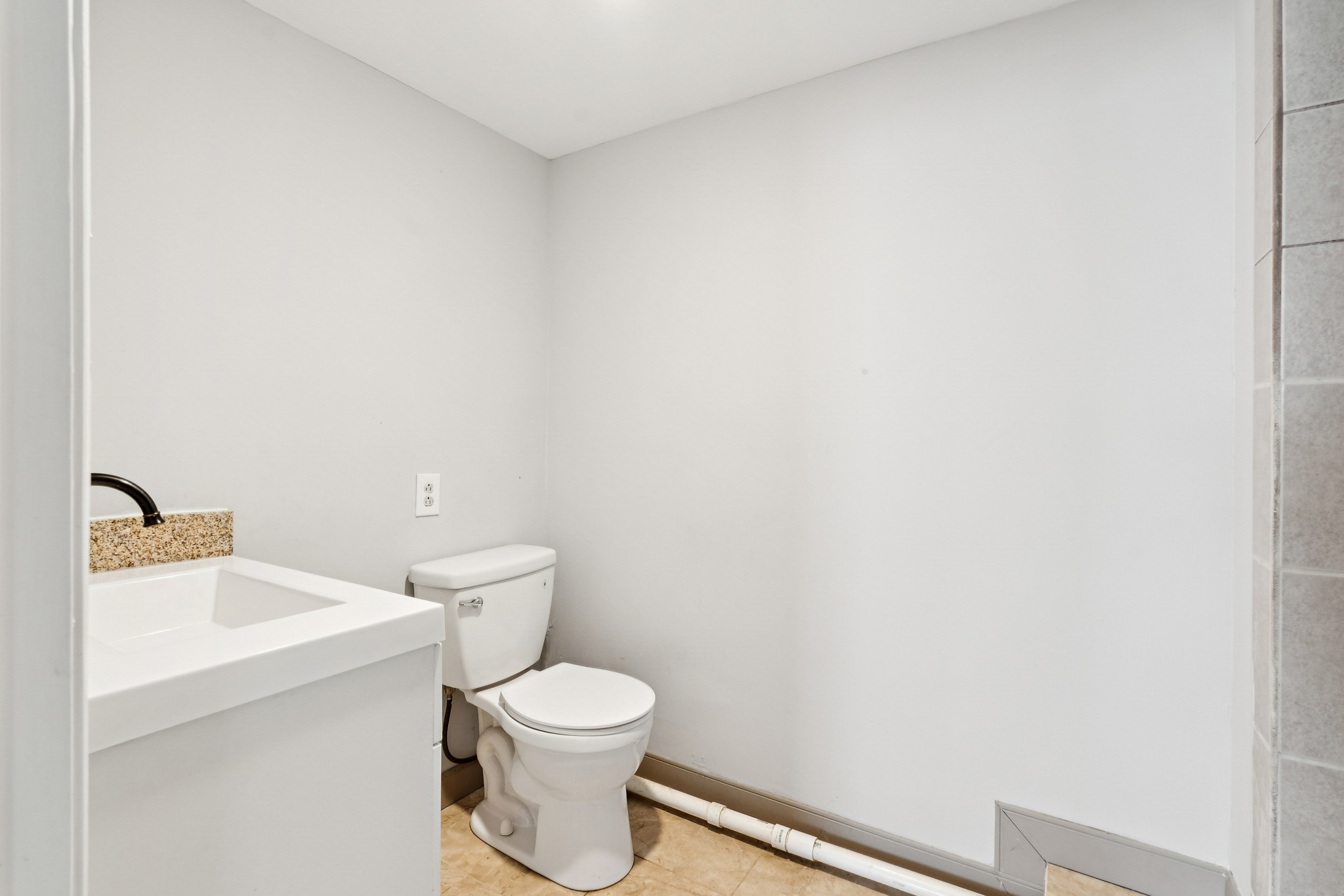 1205 Jacksons Hill Road Hermitage, TN 37076 - Photo 15 of 28 a white toilet sitting next to a bathroom sink