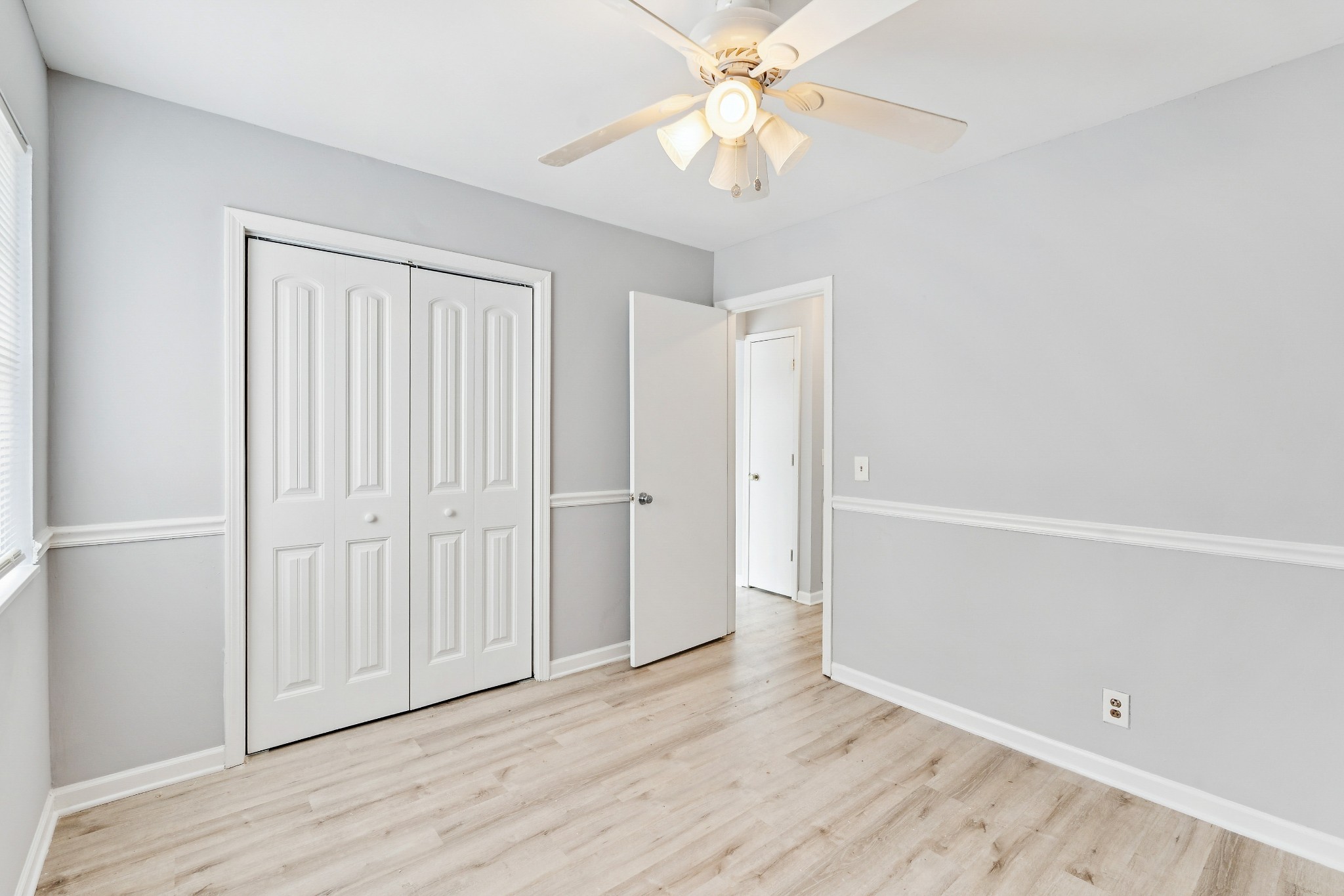 1205 Jacksons Hill Road Hermitage, TN 37076 - Photo 9 of 28 an empty room with wooden floor and fan